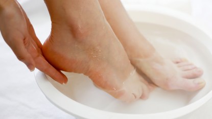 Woman's feet soaking in water