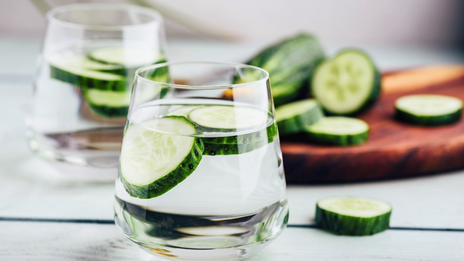 Glasses of water with cucumber slices
