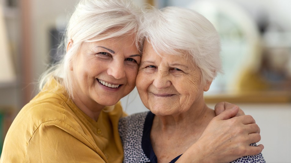 two elderly women smiling