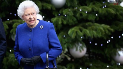 Queen Elizabeth in front of a Xmas tree
