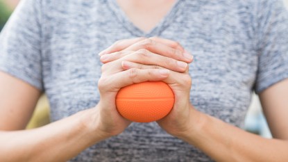 Woman squeezing a ball - story image