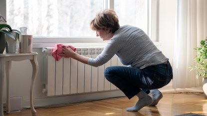 woman cleaning a radiator