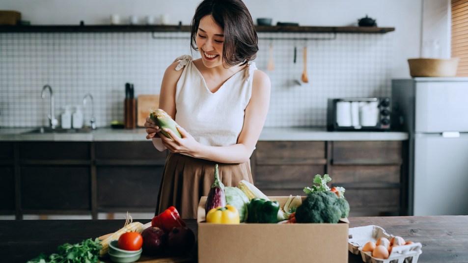 Woman Receiving Her Grocery Delivery story image