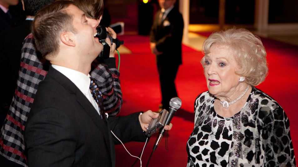 Betty White is interviewed by a reporter