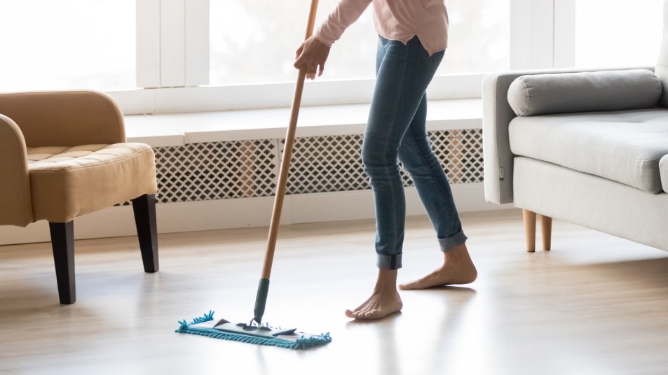 woman cleaning a hardwood floor
