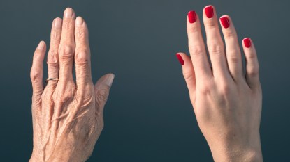 Mature hands next to youthful hands