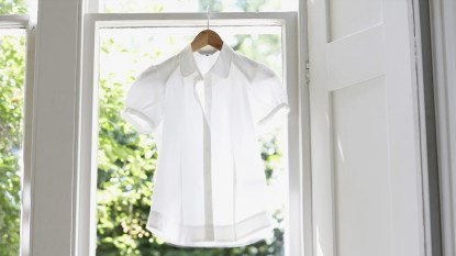 White shirt hanging in doorway