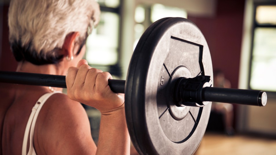 Older woman lifting weight