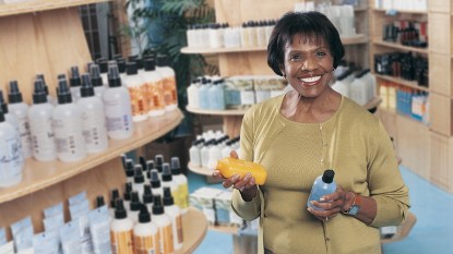 Woman shopping for shampoo