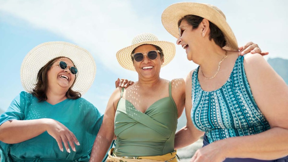 3 women laughing and enjoying the sun