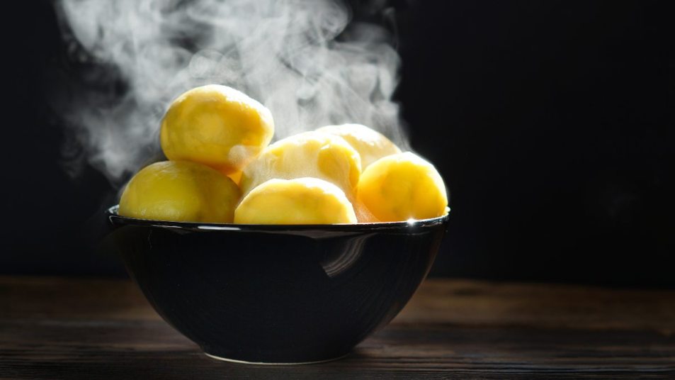 boiled potatoes steaming in a bowl, mushy potatoes concept