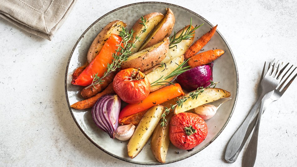 A plate full of roasted vegetables as part of a guide on reheating them