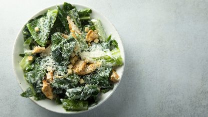 caesar salad topped with grated parmesan, croutons and homemade Caesar dressing