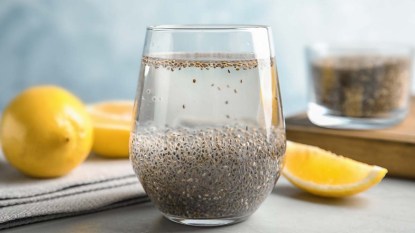 A-composition-with-glass-of-water-chia-seeds-and-lemon-on-table-internal-shower-drink
