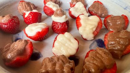 homemade chocolate and vanilla cheesecake deviled strawberries in a gray dish