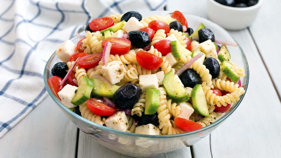 Greek-Salad-with-pasta-on-white-background