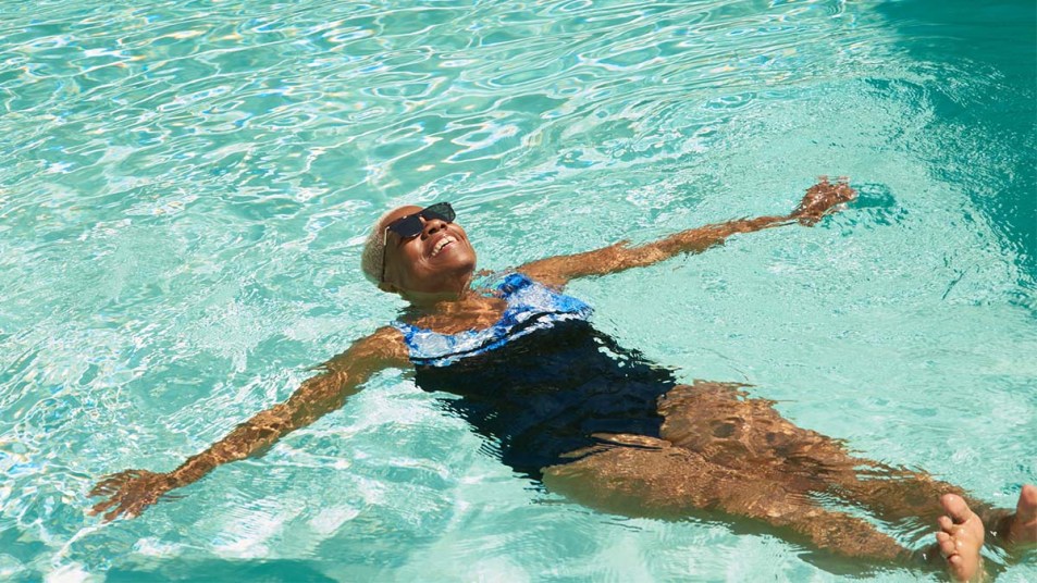 Woman-enjoying-a-swim-in-a-large-pool