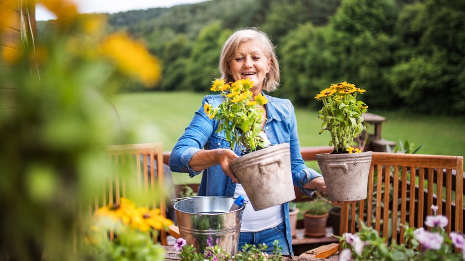 Woman holding flower pots