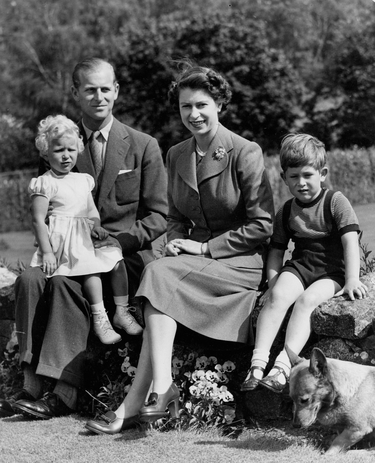 A portrait of the British Royal family including, from left, PRINCESS ANNE, PRINCE PHILIP, QUEEN ELIZABETH II, PRINCE CHARLES, one of the royal pet Corgis