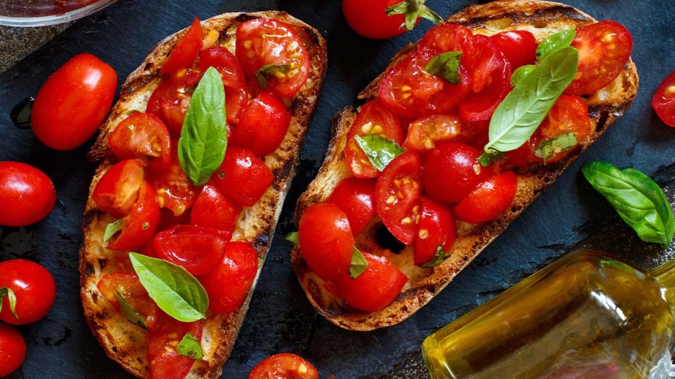 Homemade Italian Bruschetta Appetizer with cherry tomatoes and basil
