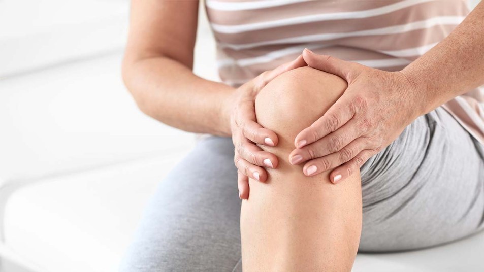 Mature woman suffering from pain in knee