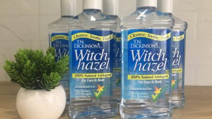 bottles of TN Dickinson's witch hazel next to a green plant