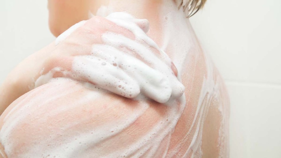 Woman washing her skin