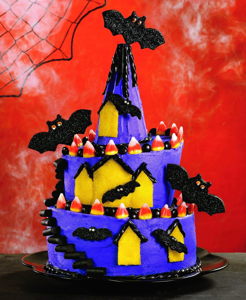 Purple cake in the shape of a haunted house