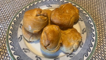 homemade hocus pocus buns on a fish-themed plate cropped