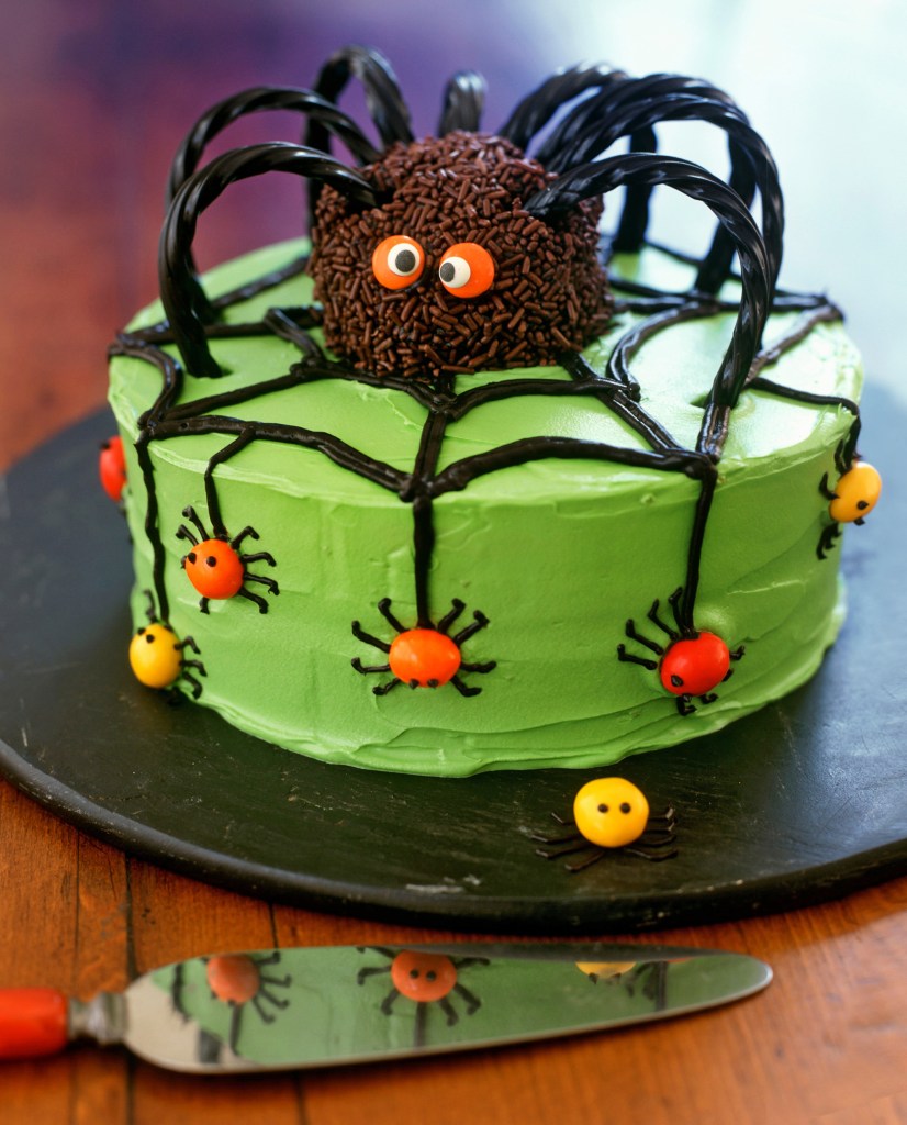 Green cake with spider decoration