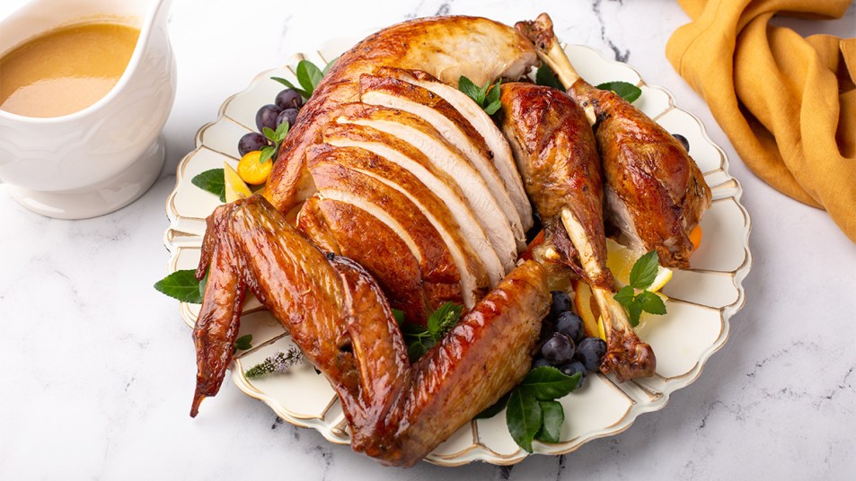 A carved roasted turkey on a serving platter