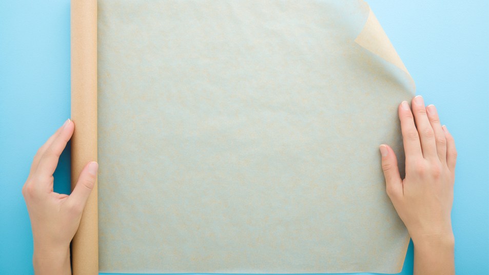 sheet of wax paper on blue background; uses for wax paper