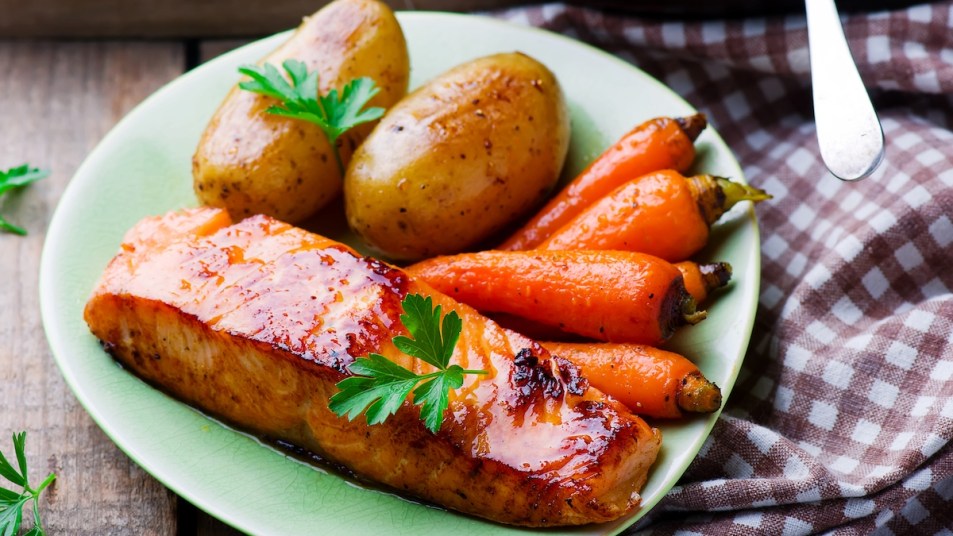 Plate of maple salmon with carrots and potatoes