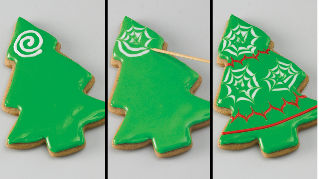 Decorating Christmas tree cookies with royal icing