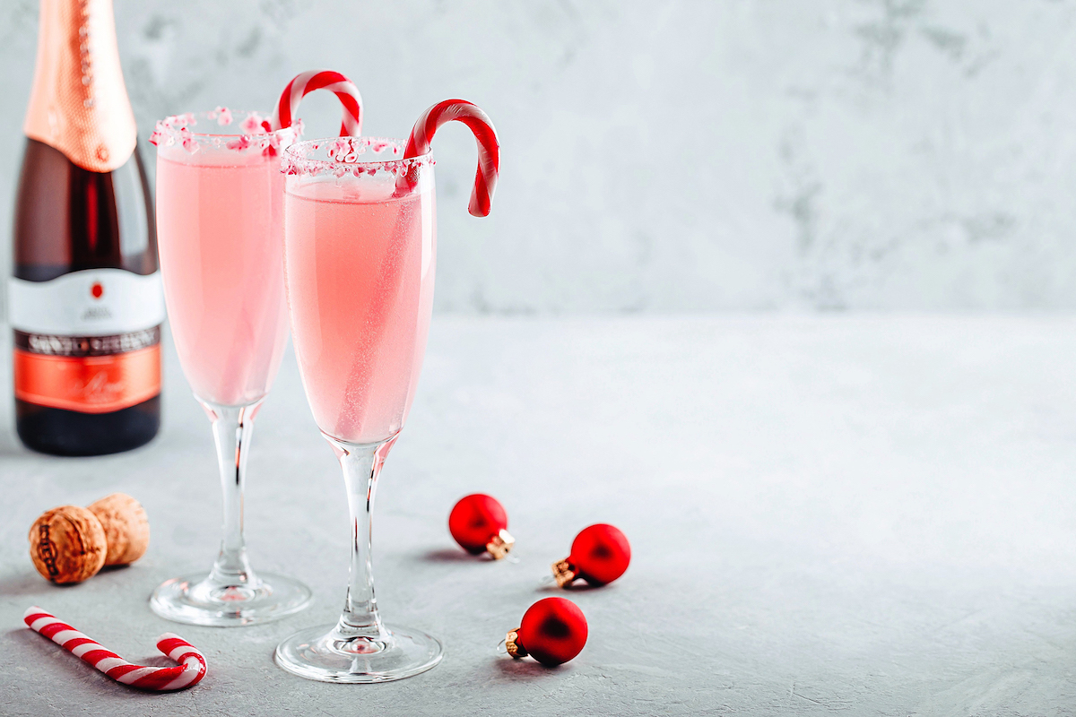 Two Peppermint Bark Mimosa cocktails on table