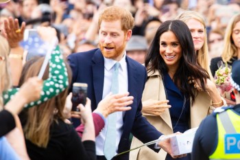Prince harry and Meghan Markle in a crowd