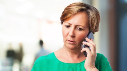 mature woman with blonde short hair on the phone