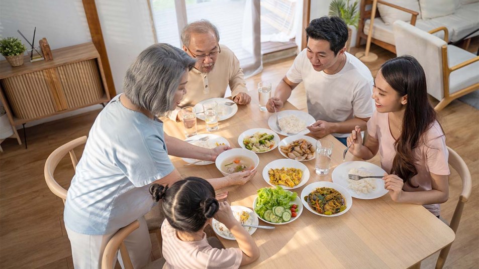 A family enjoying a meal around a table