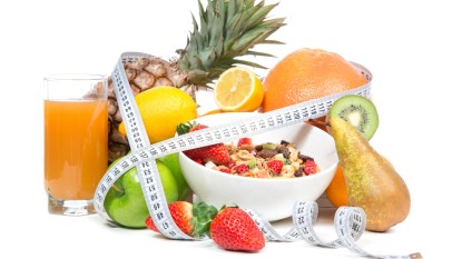 foods for a weight loss anti-inflammatory diet with measuring tape around them