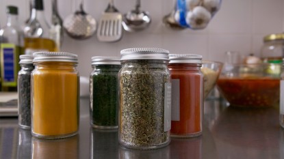 spice jars on a kitchen counter: dirtiest places in the house