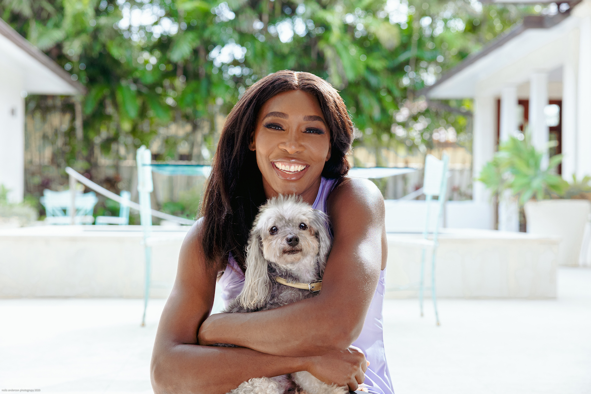 Tennis player Venus Williams holding her dog