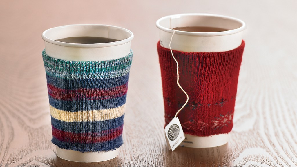 uses for old socks: cut socks over paper coffee cups to keep hands warm