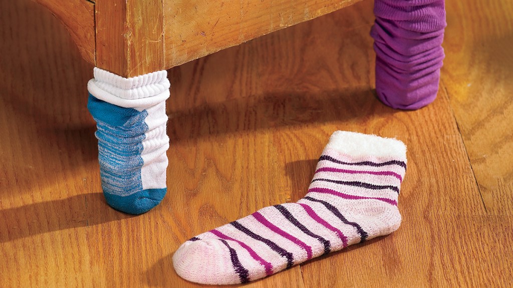 uses for old socks: socks on furniture legs to prevent scraping the floor