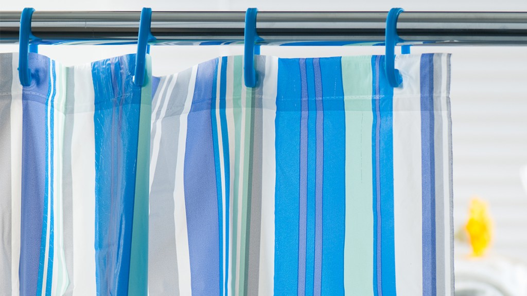 striped shower curtain in bathroom: dirtiest places in the house