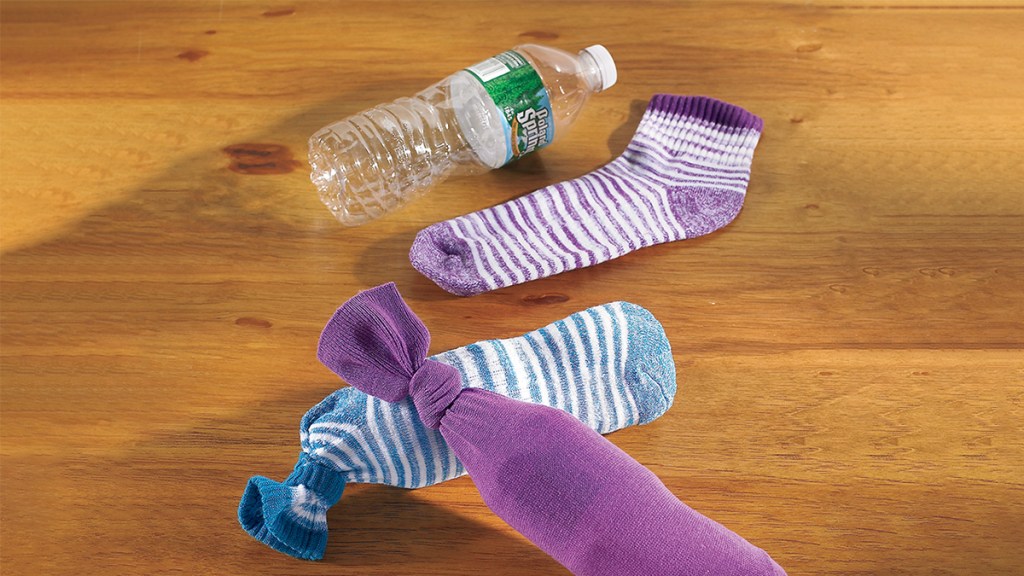 uses for old socks: sock over a plastic water bottle= dog toy