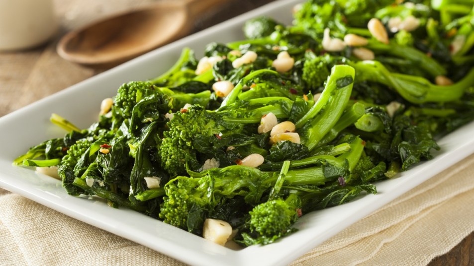sauteed broccoli rabe and garlic on a white plate