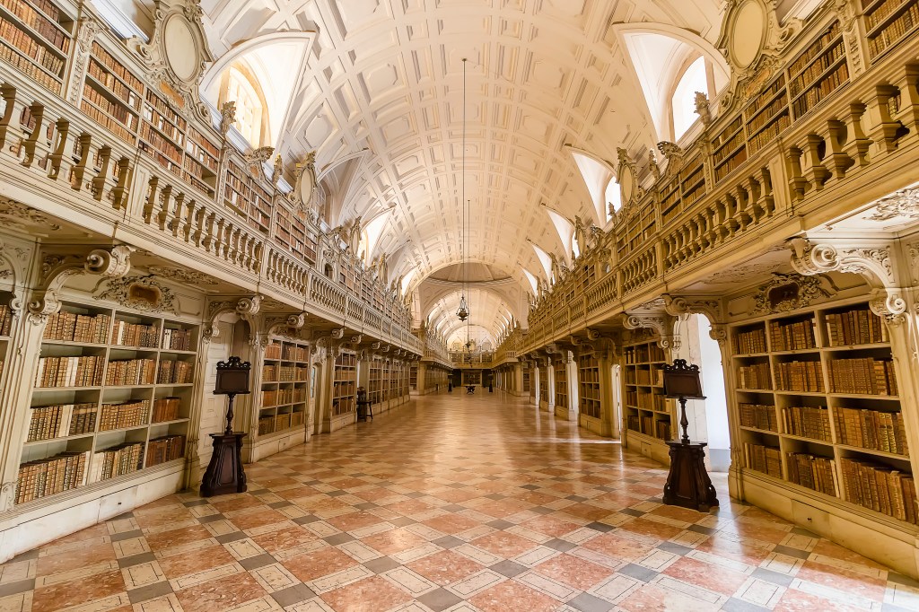 Library of the Mafra National Palace. Franciscan religious order. 18th Century Baroque architecture in Lisbon, Portugal - December 2017