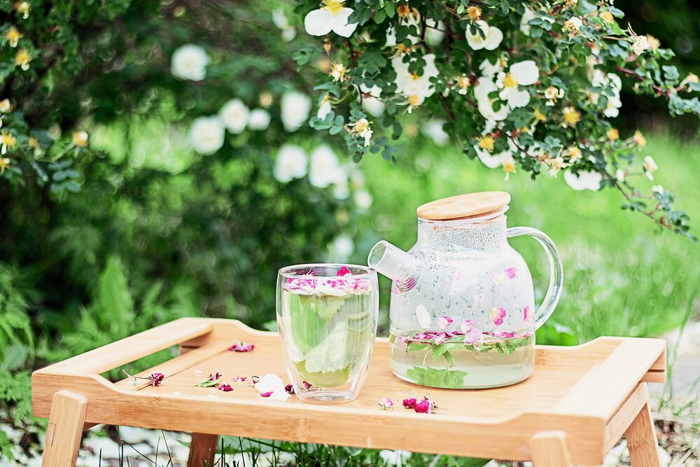 flower tea in clear glass teapot