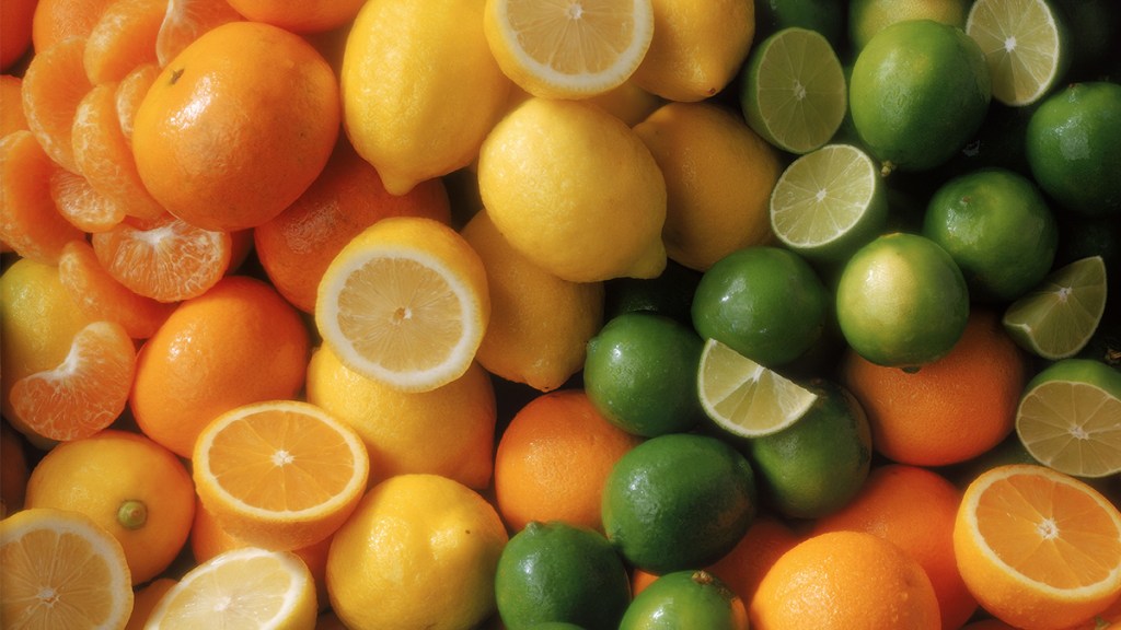 bunch of citrus fruit: limes, oranges, lemons scrambled eggs: best foods for bone health 
