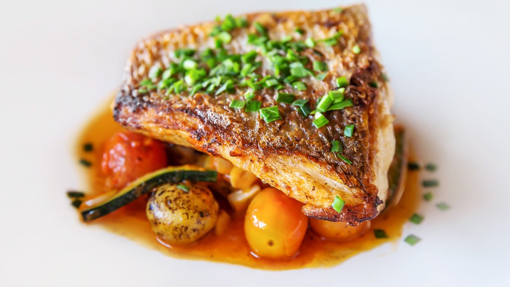 cooked swordfish with veggies: best foods for bone health 
